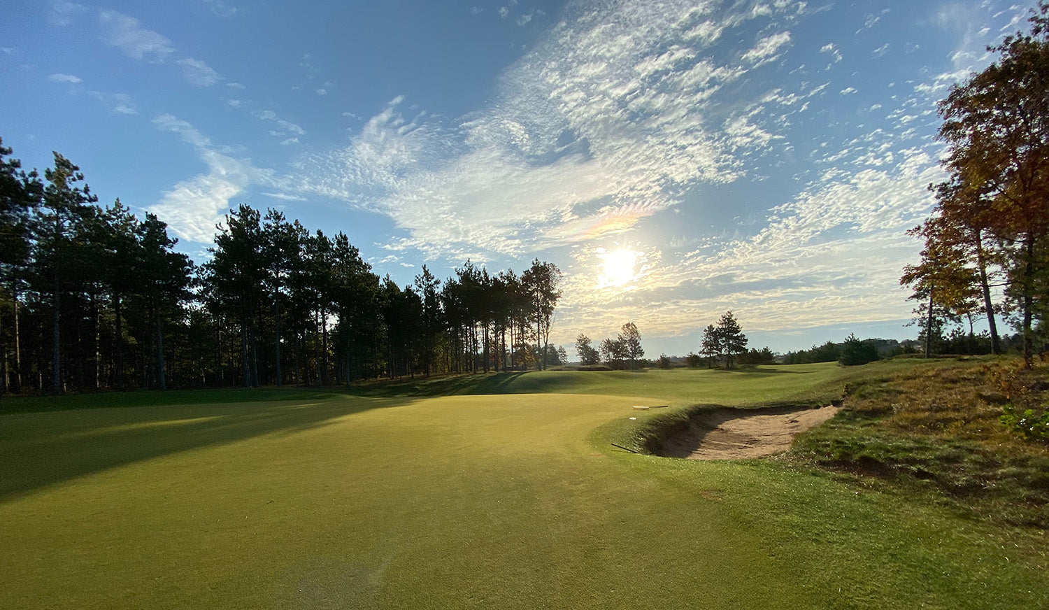 view of a golf course in Manitoba under a blue sky