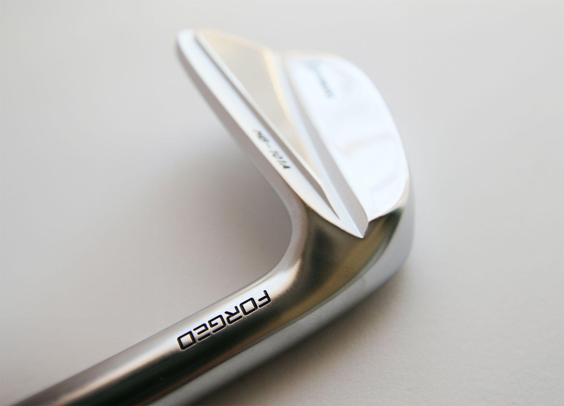 golf club angle shown in a wedge on a clear background