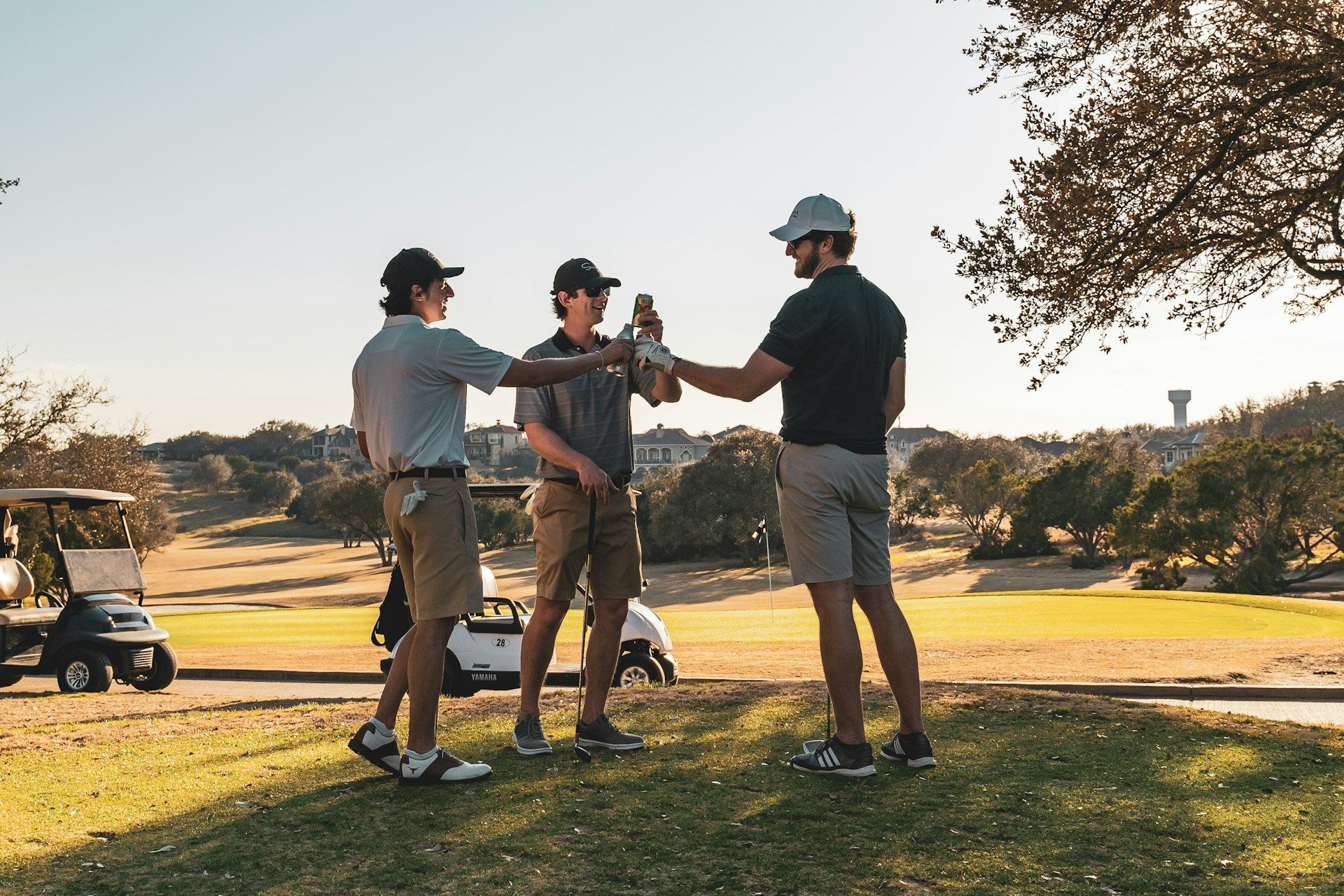 Friends meeting just before starting a golf match discussing how to play golf