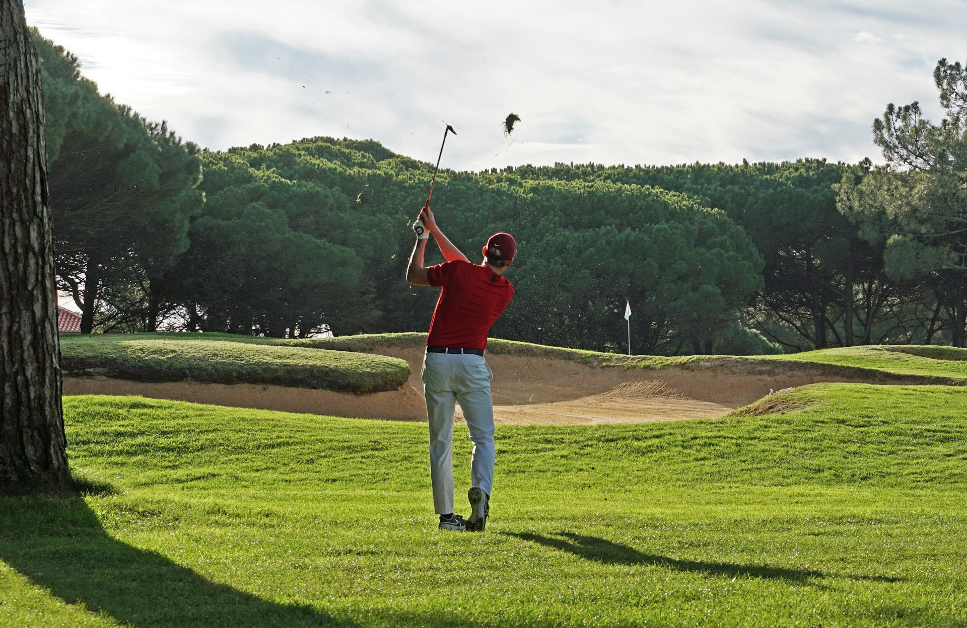 golf player playing golf in a golf field marking his handicap
