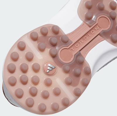 Close-up of the sole of an Adidas MC Zoysia Ladies Spikeless Golf Shoe in grey, showing circular rubber grips, Torsion System on a central bar, BOOST cushioning, and a small Adidas logo.