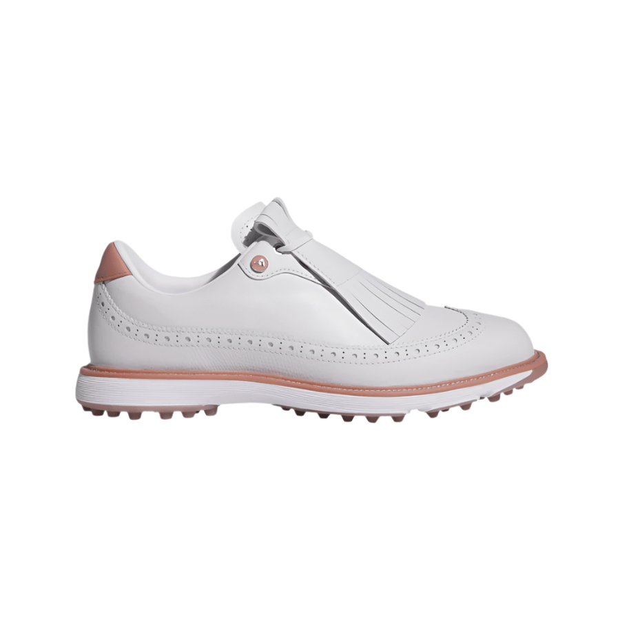 The Adidas MC Zoysia Ladies Spikeless Golf Shoes - Grey combine classic style and BOOST comfort, featuring grey leather with decorative perforations, a fringed tongue, pink accents, and a textured sole.