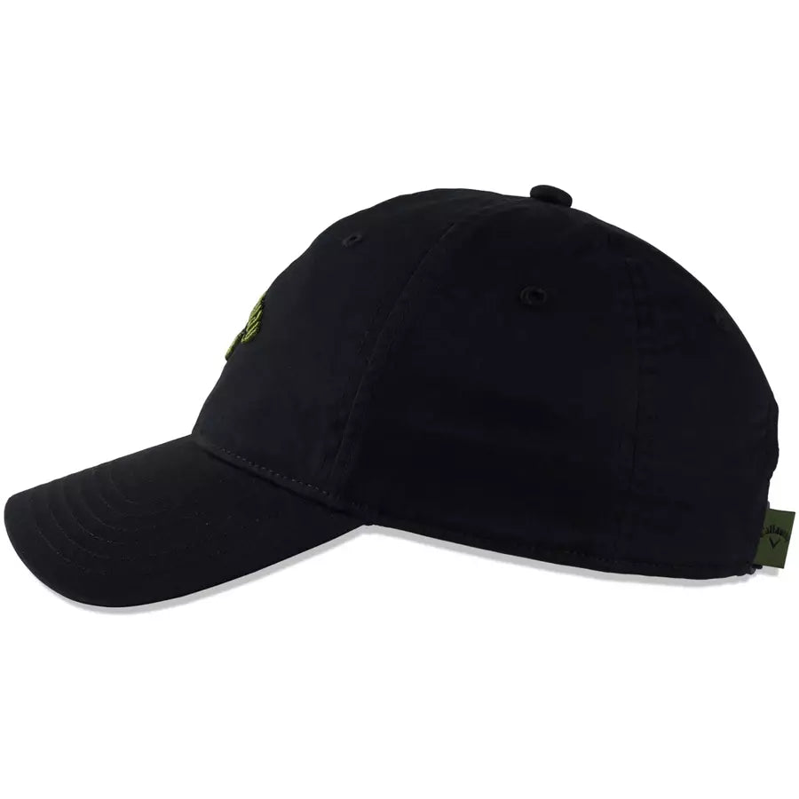 A side view of the 2 Pack Callaway Heritage Twill Golf Hats in black, featuring a curved brim, embroidered Callaway logo, and a small green tag on the back.
