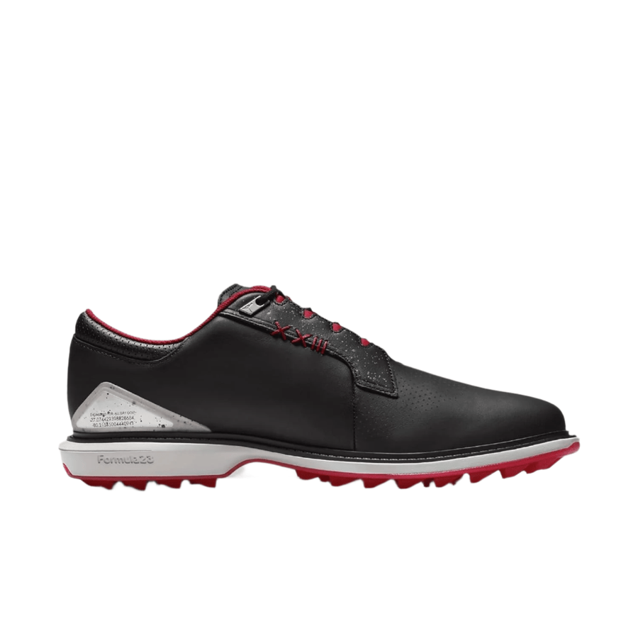 The Jordan ADG 5 Golf Shoes - Black feature black leather uppers, a red and white sole, red lace accents, silver heel detail, Formula 23 foam for comfort, perforations for ventilation, and a sporty rubber traction outsole.