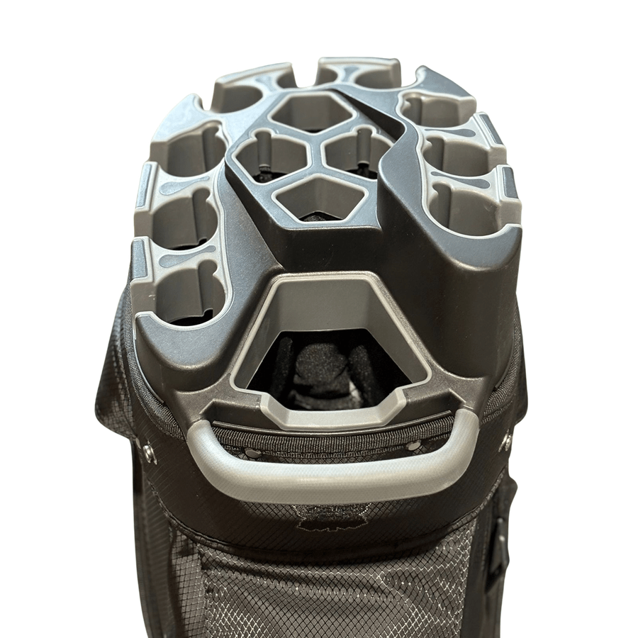 Top view of the NS Deluxe Tour Lock Organizer Cart Bag in black and gray, featuring a 14-way divider, multiple club compartments, molded plastic handle, and an insulated cooler pocket for drinks.