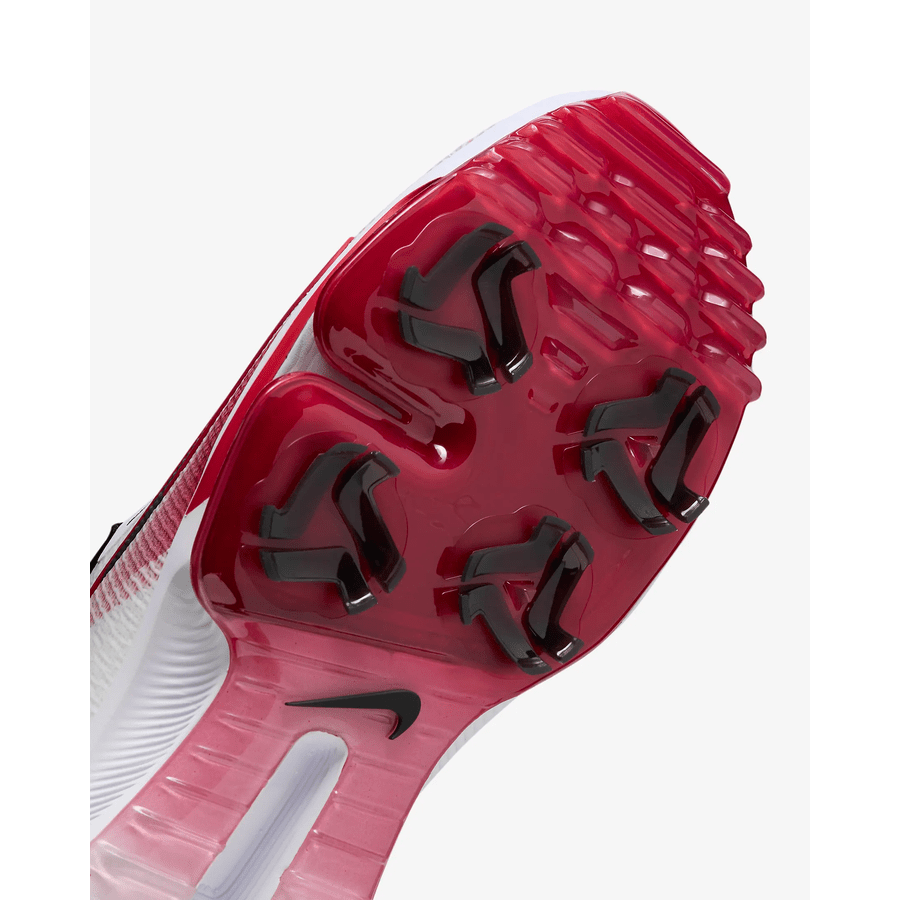 Close-up of the red and black spikeless sole of the Nike Air Zoom Infinity Tour NXT 2 Golf Shoe (White/Red), highlighting four black studs, a bold black Nike swoosh, and visible Air Zoom cushioning against a white background.