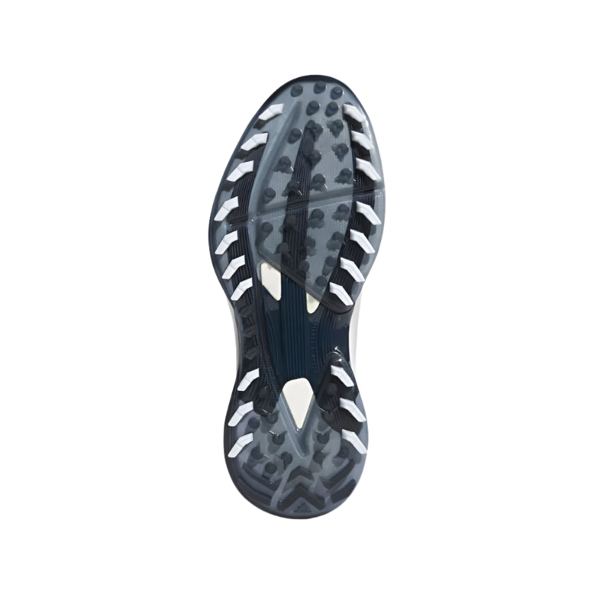 The image shows the sole of the Adidas Adizero ZG Spikeless Golf Shoes - White/Blue, featuring a black and white pattern with multiple small rubber studs for traction, photographed from below against a white background.