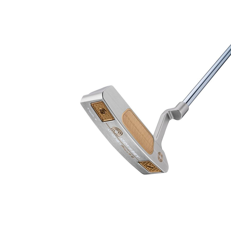 A close-up of the Odyssey Ai-ONE Silver Milled Two T CH Putter shows its silver finish with gold and bronze accents, a textured face with a milled titanium insert, and decorative details against a white background.
