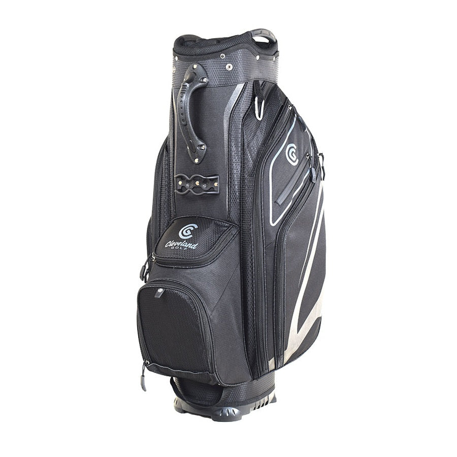 The Cleveland Golf Lightweight Cart Bag in black and gray stands upright on a white background, featuring multiple zippered compartments, a velour-lined valuables pocket, carrying handle, insulated cooler pocket, and built-in stand.