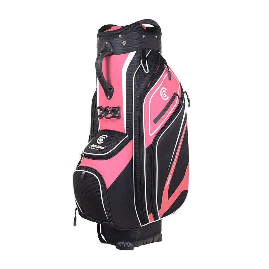 The Cleveland Golf Lightweight Cart Bag, shown in pink, black, and white, features multiple zippered pockets—including a velour-lined valuables pocket and an insulated cooler pocket—a top handle, and stands upright on a white background.