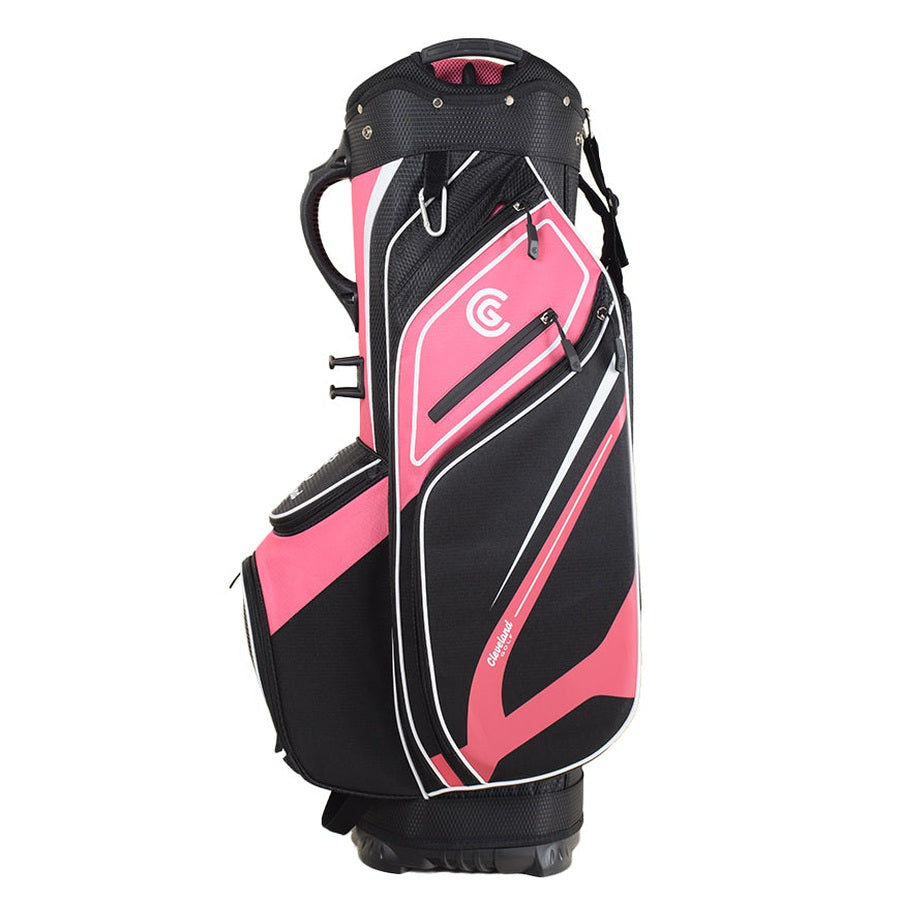 The Cleveland Golf Lightweight Cart Bag in black, pink, and white stands upright against a white background, featuring multiple pockets, a velour-lined valuables pocket, and a bold white CG logo on the side.