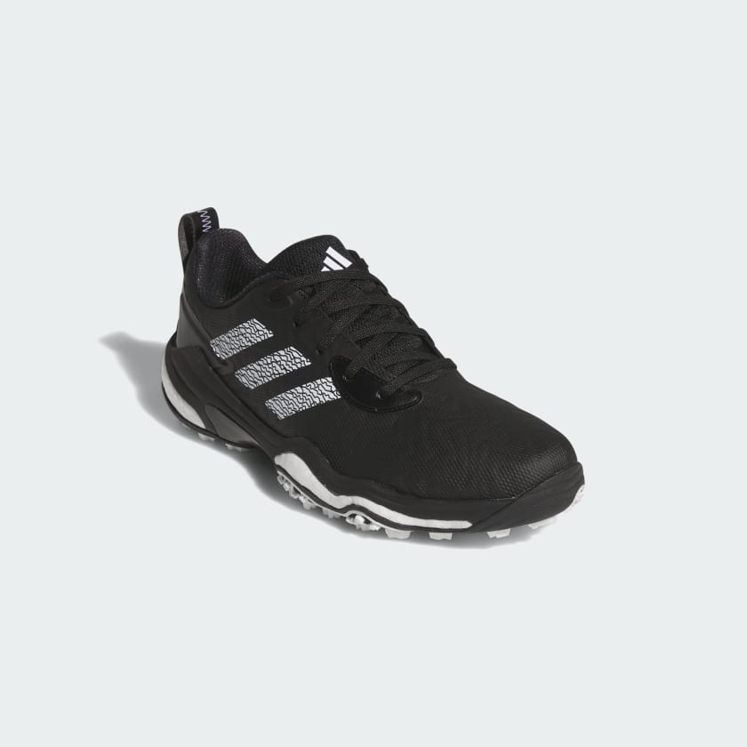 The Adidas Codechaos 25 Spikeless Golf Shoes in black feature a waterproof lace-up upper, white sole accents, three white side stripes, and a pull tab at the heel.