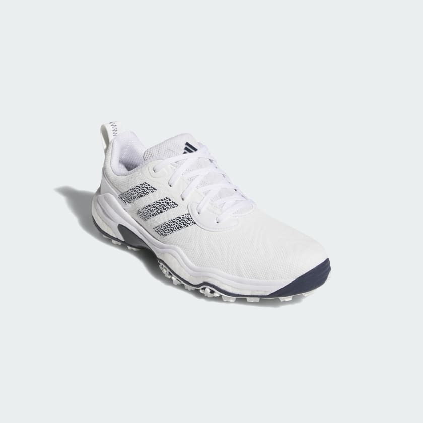 The Adidas Codechaos 25 Spikeless Golf Shoes in White/Navy feature the iconic three-stripe logo, white laces, and detailing, crafted from recycled materials. Shown against a plain light background.