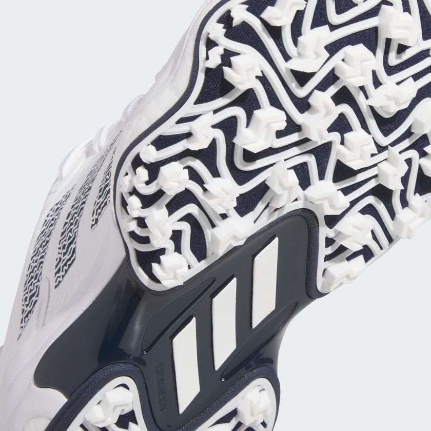 Close-up of the Adidas Codechaos 25 Spikeless Golf Shoes in White/Navy, featuring a geometric tread and signature three stripes—ideal for golf and crafted with recycled materials.