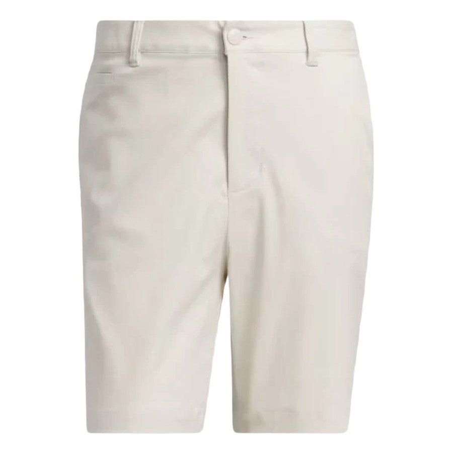 The Adidas Go-To Five-Pocket Golf Shorts, in light beige, knee-length, feature belt loops, button closure, and a zip fly. They are shown from the front against a white background.