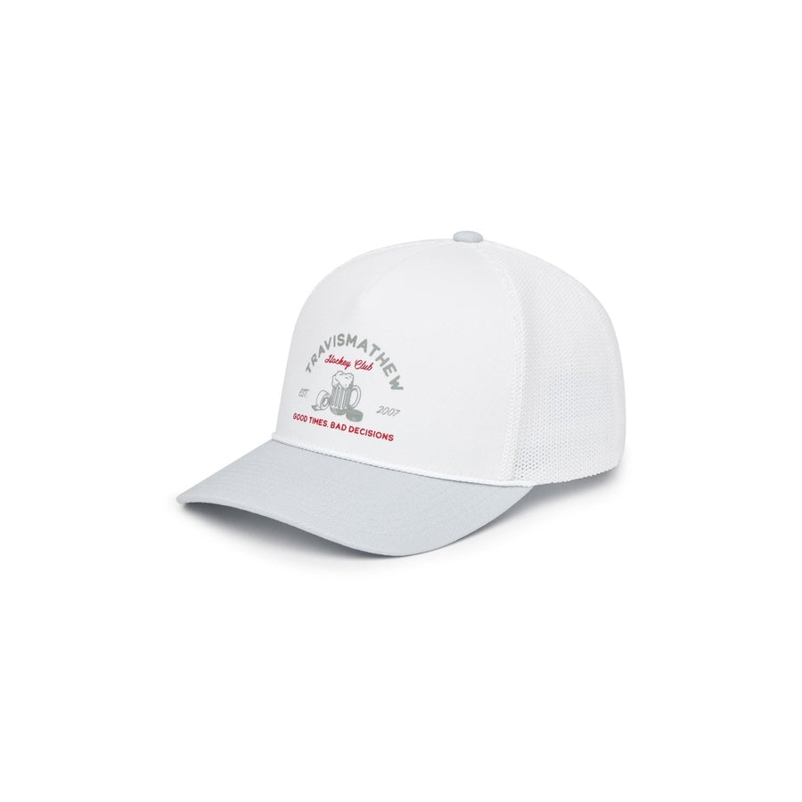 The Travis Mathew Hossmoor Canada Adjustable Hat features a white and light gray design, mesh back, red and gray graphics, and TRAVISMATHEW with GOOD TIMES BAD DECISIONS text on the front. Part of the Destinations Collection.
