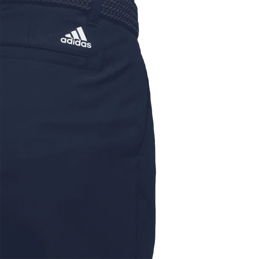 Close-up of the upper section of Adidas Ultimate365 Pants - Blue, showing a logo above the pocket, a woven navy belt, and crafted with recycled materials.