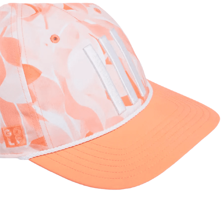 The Adidas Orange Season Opener Golf Hat features a peach and white design with three white stripes on the front, a peach brim, subtle floral accents, a side logo patch, and is made with recycled materials.