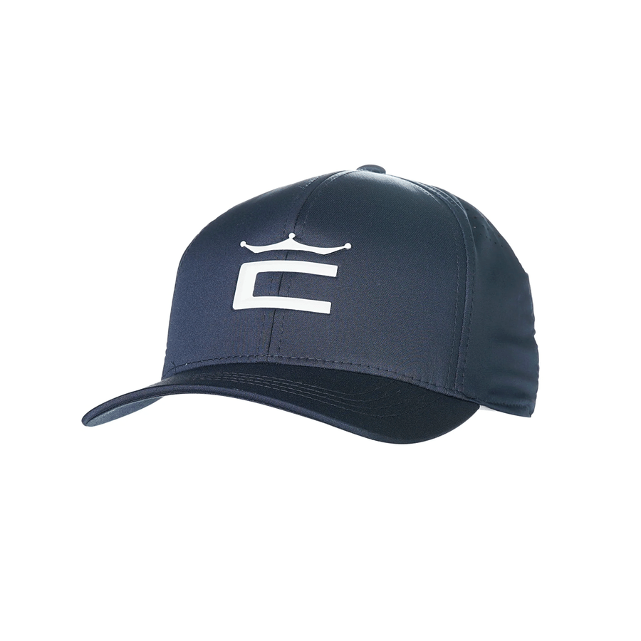The Cobra Tour Crown Snapback Cap is dark blue with a white stylized C and crown on the front, features a moisture-wicking sweatband, and is shown against a white background.