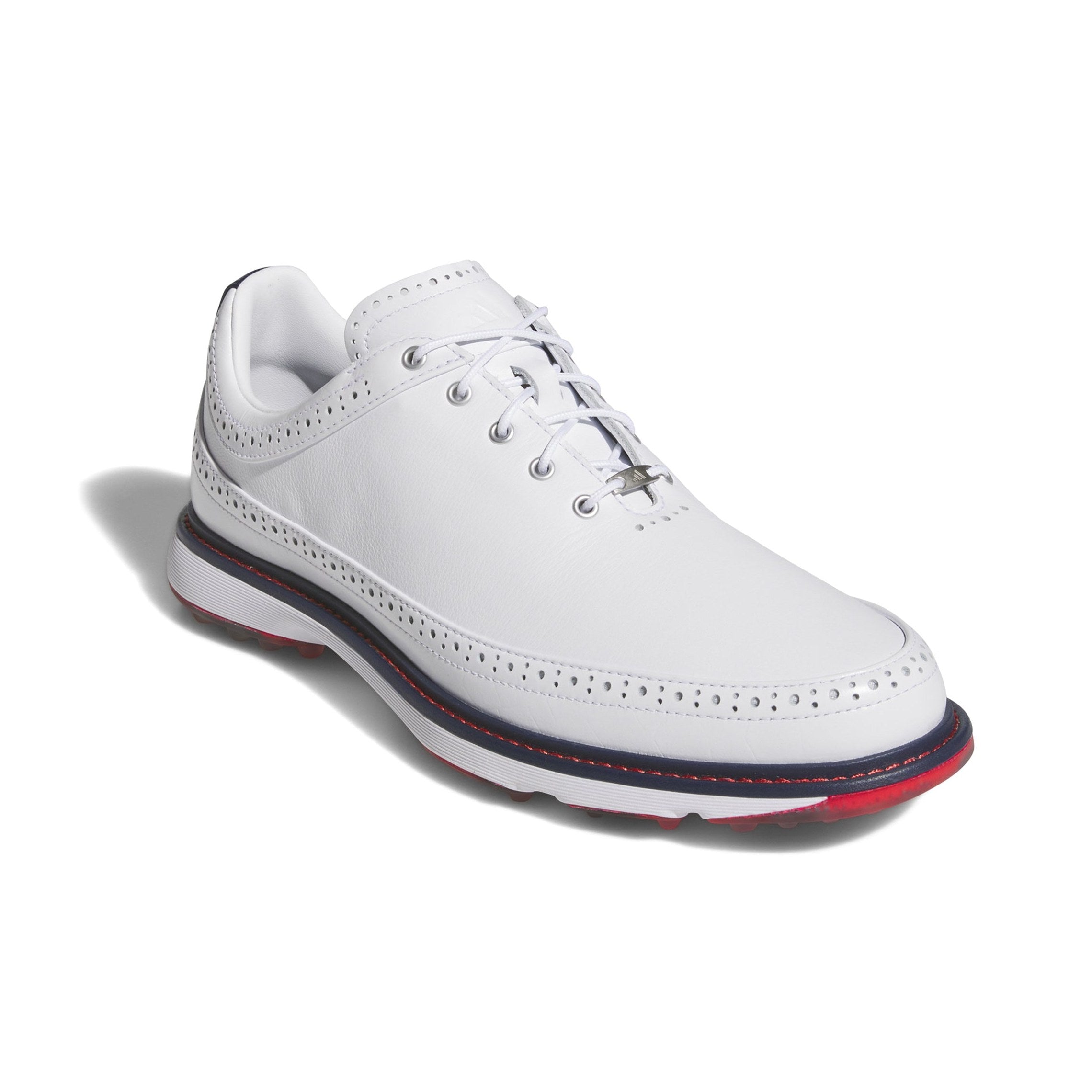The Adidas MC80 Golf Shoes in White/Red feature a white leather upper with decorative perforations, white laces, a thick white sole with red and navy accents, and a spikeless design. Displayed on a white background.