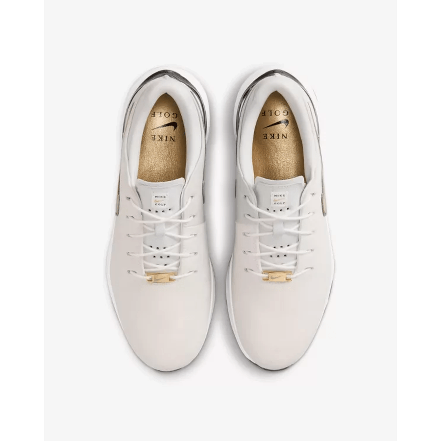 A top-down view of Nike Air Zoom Victory Tour 3 NRG Golf Shoes in White/Gold shows full-grain leather, white laces, gold tongue detailing, and the Nike Golf logo inside, all set against a white background.