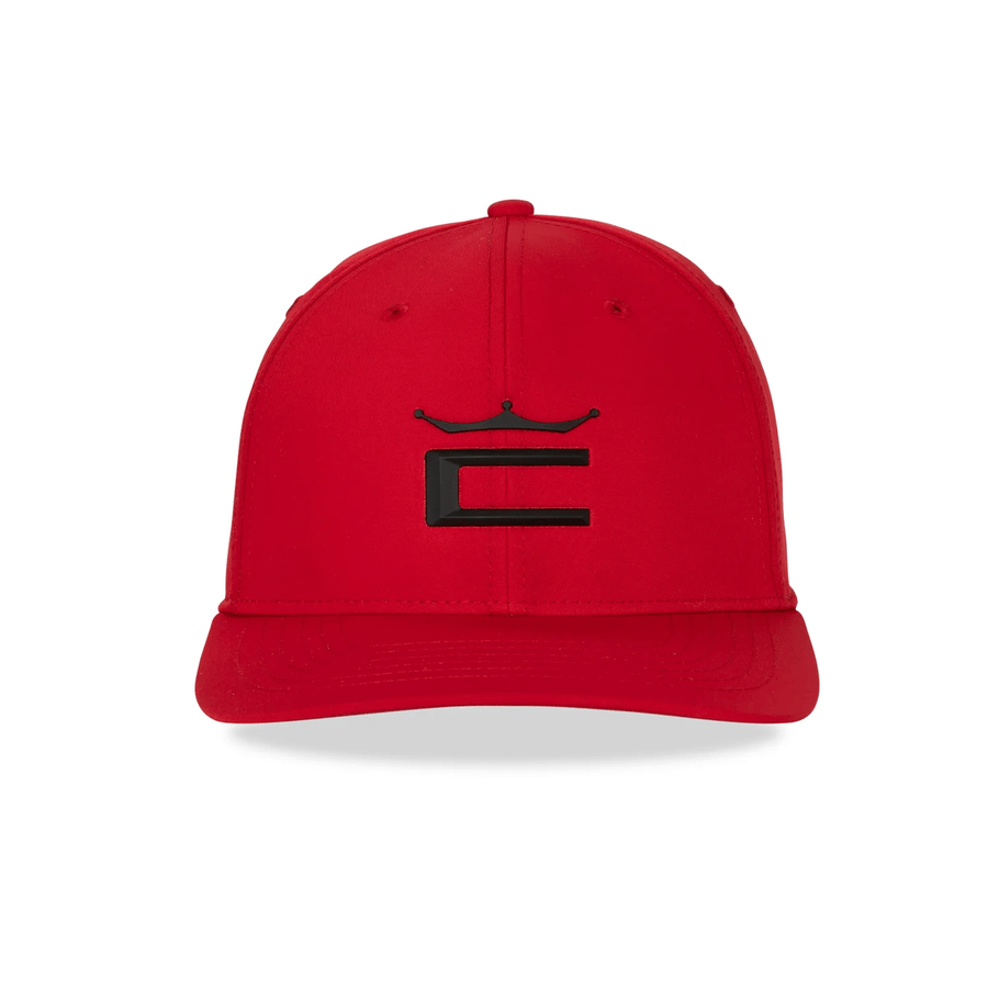 The Cobra Tour Crown Snapback Cap is red with a black stylized C and crown logo, shown on a white background. It features a moisture-wicking sweatband for comfort.
