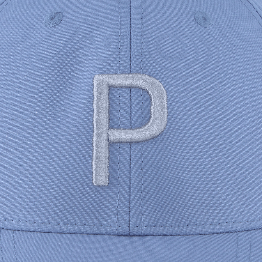 A close-up of the Puma Structured P Cap in light blue displays a large, raised white embroidered P on the front and showcases its form-fitting style.