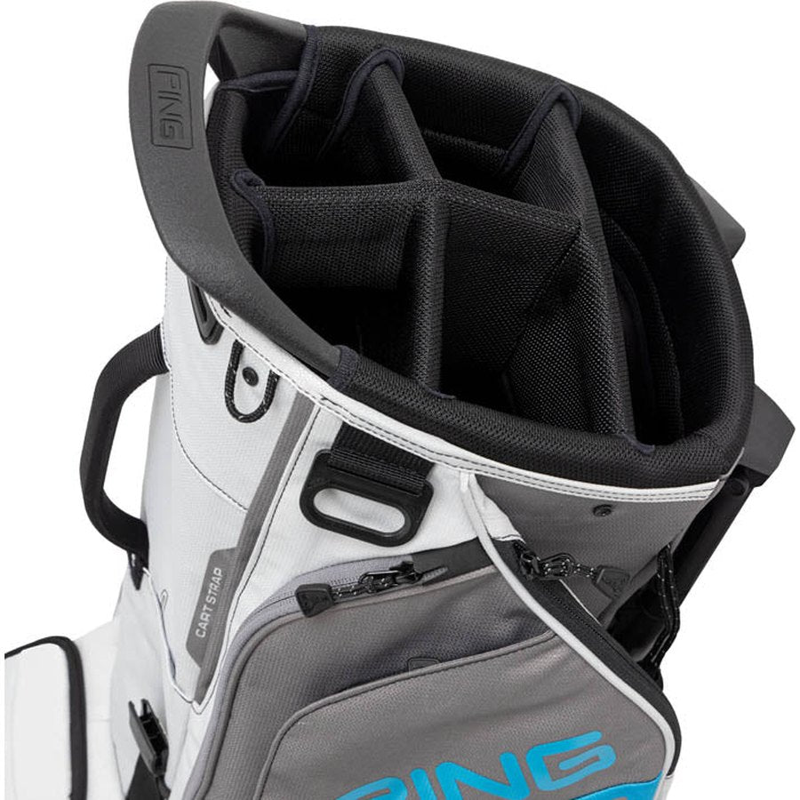 A close-up of the top section of the lightweight Ping Hoofer 231 Golf Carry Bag in white and gray, featuring black club dividers. The PING logo is visible on both the handle and side pocket.