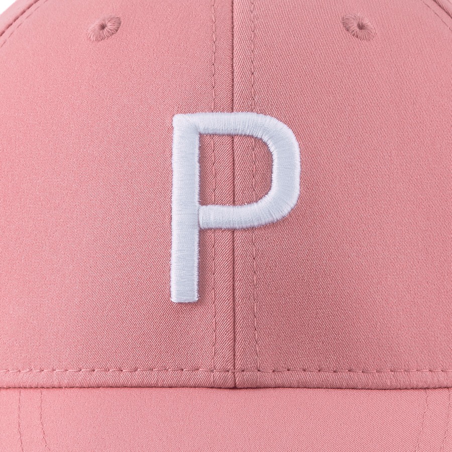 A close-up of the Puma Structured P Cap in pink, showcasing a large white embroidered letter P on the front and a form-fitting design.
