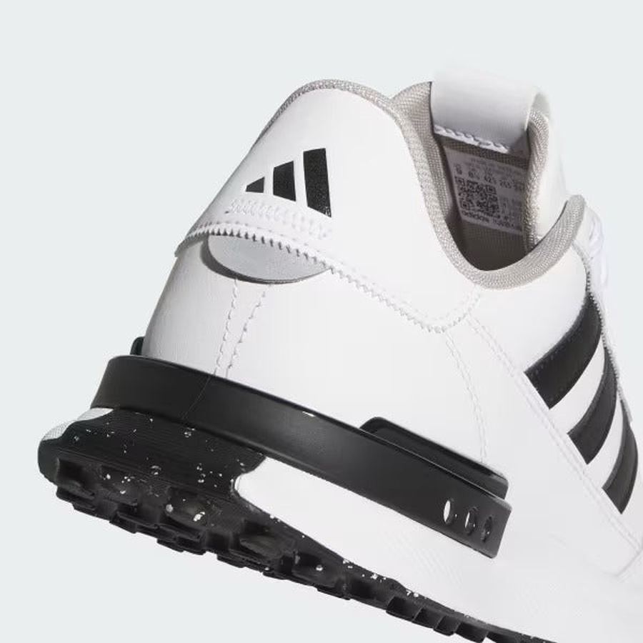 Close-up of the Adidas S2G 24 Leather Spikeless Golf Shoes in white/black, showing the heel with black accents, three black stripes, Adidas logo on the back, and a textured black sole.