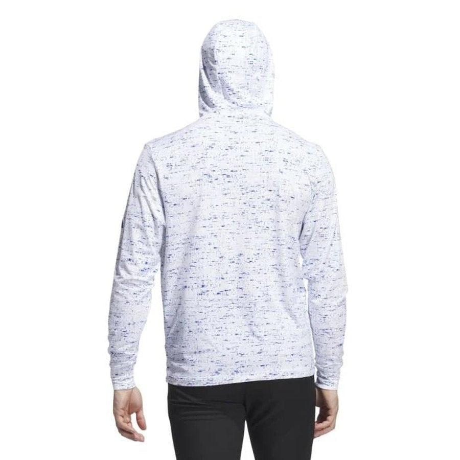 Someone is shown from the back wearing a Two Pack Adidas Core Printed Lightweight Hoodie in a light color with a subtle blue speckled pattern, hood up. The stretchy, comfortable hoodie is paired with black pants.