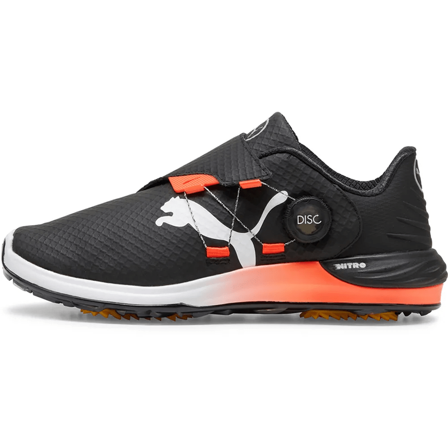 The PUMA Phantomcat Nitro Disc Golf Shoes - Black feature a black design with a white Puma logo, orange accents, DISC dial closure, NITRO foam tech, textured upper, and a white-orange sole for style and comfort on the course.