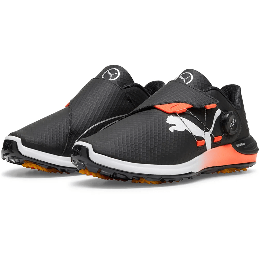 The PUMA Phantomcat Nitro Disc Golf Shoes - Black feature white soles, orange accents, a large white Puma logo, NITRO foam technology, a slip-on design with strap, and a BOA-style Disc adjustment dial.