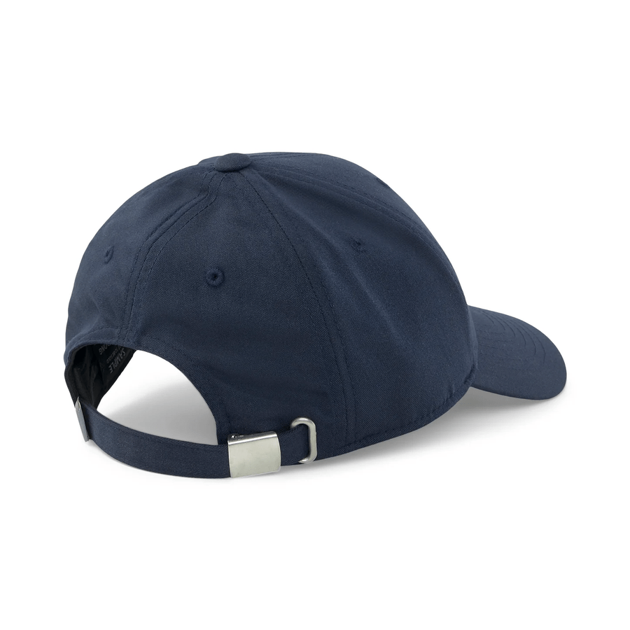 The Puma Structured P Cap in navy showcases an adjustable strap with metal clasp and visible stitching at the back. It features a form-fitting design, curved brim, and eyelet vents on the crown for style and comfort.