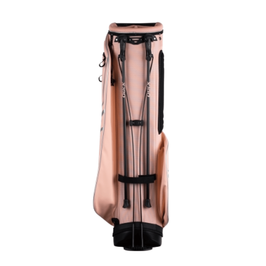 The XXIO Ladies Stand Bag is displayed upright from the front on a plain white background, with two slim black support legs extended, multiple storage compartments, and black accents on the bottom and side.