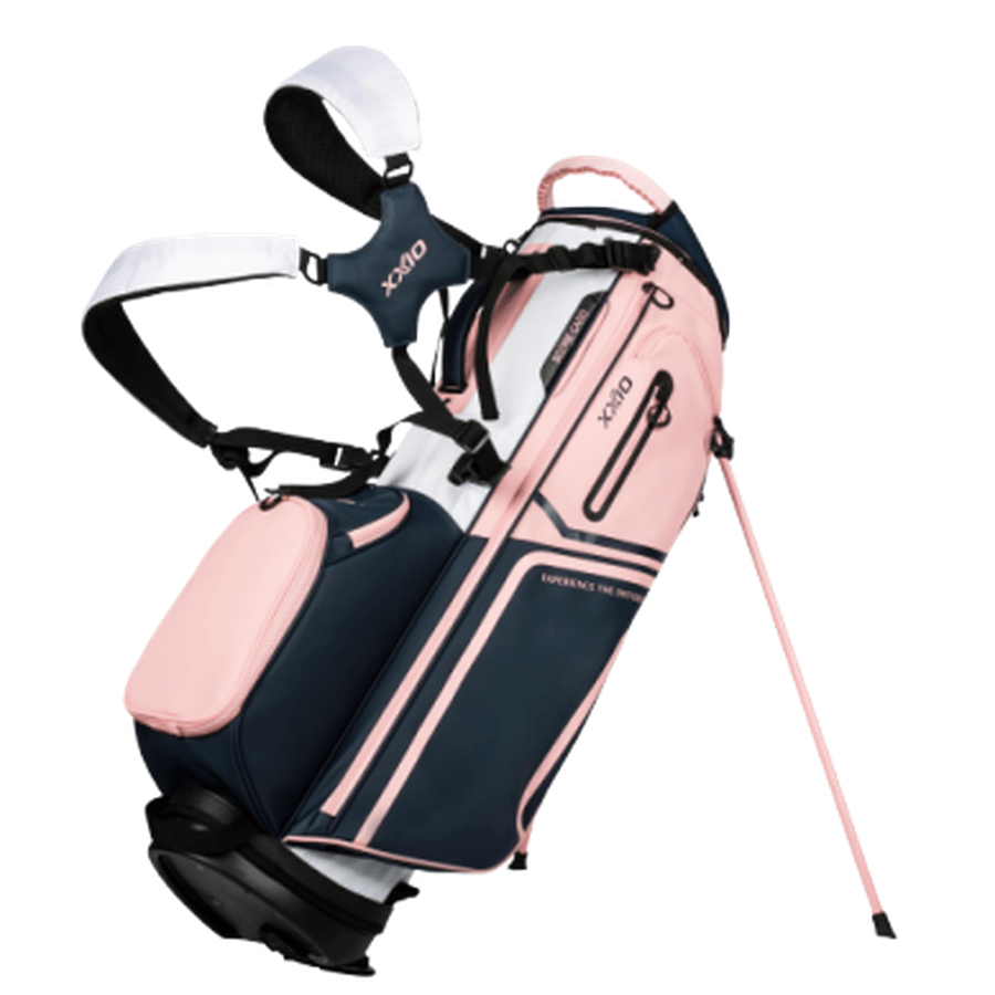 The XXIO Ladies Stand Bag offers multiple storage pockets, dual shoulder straps, and a supportive stand mechanism. Available in navy blue, light pink, and white.