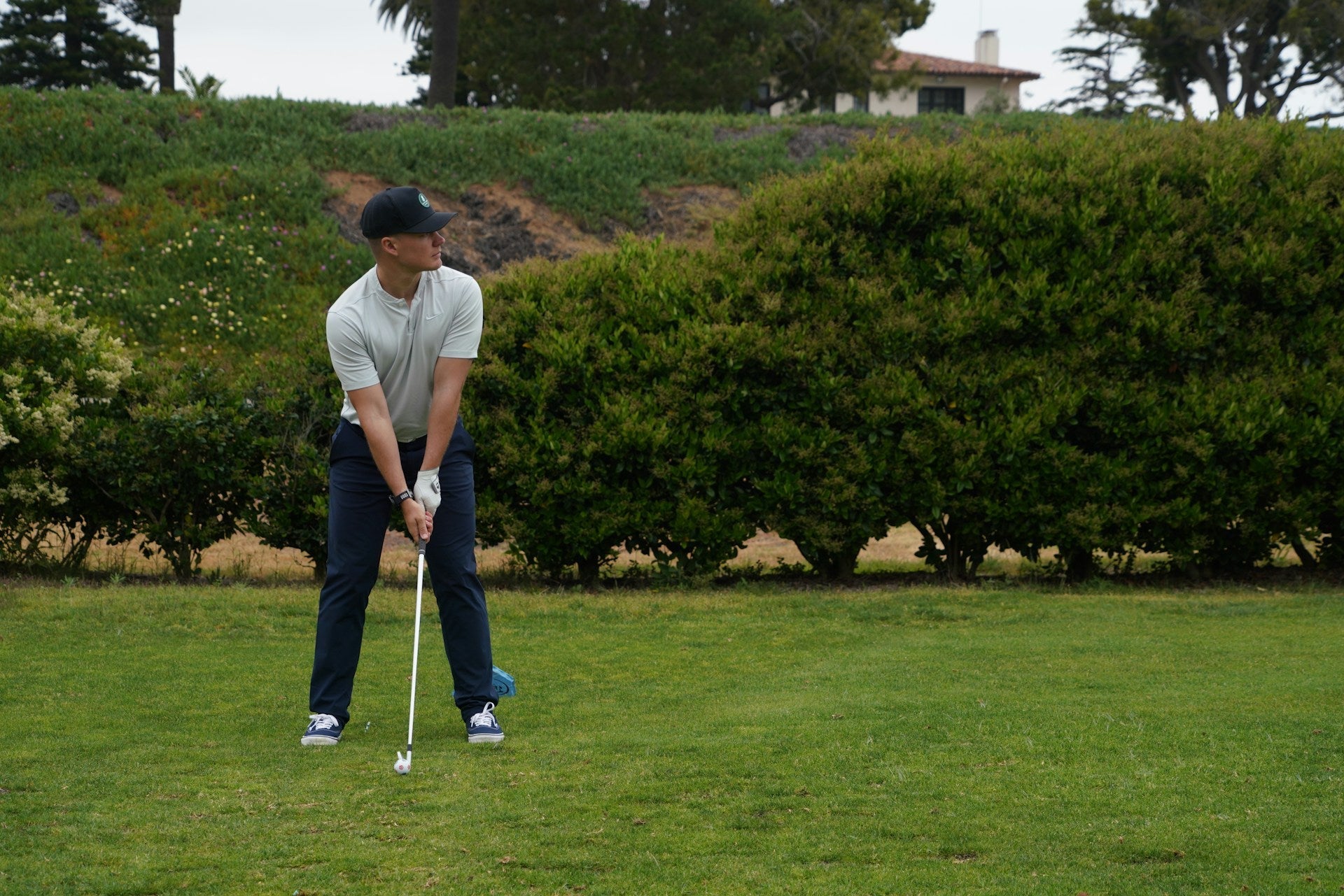 golfer wearing Adidas SG2 golf shoes in the field