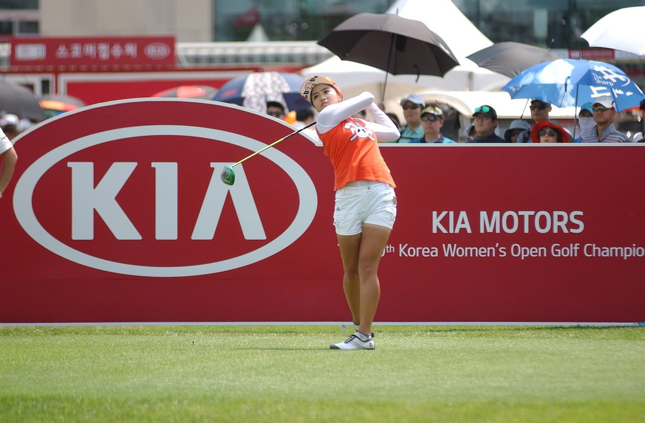 woman playing golf during a golf event