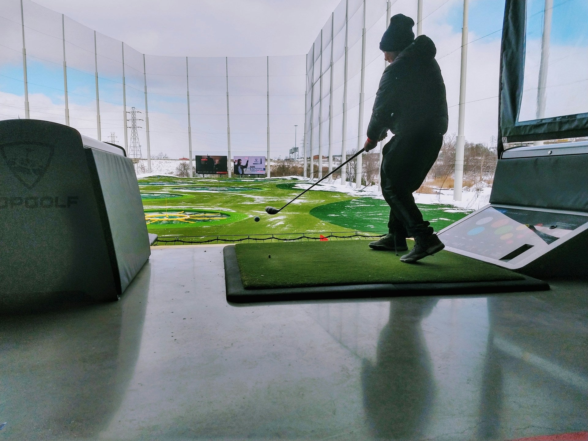 player using a golf simulator