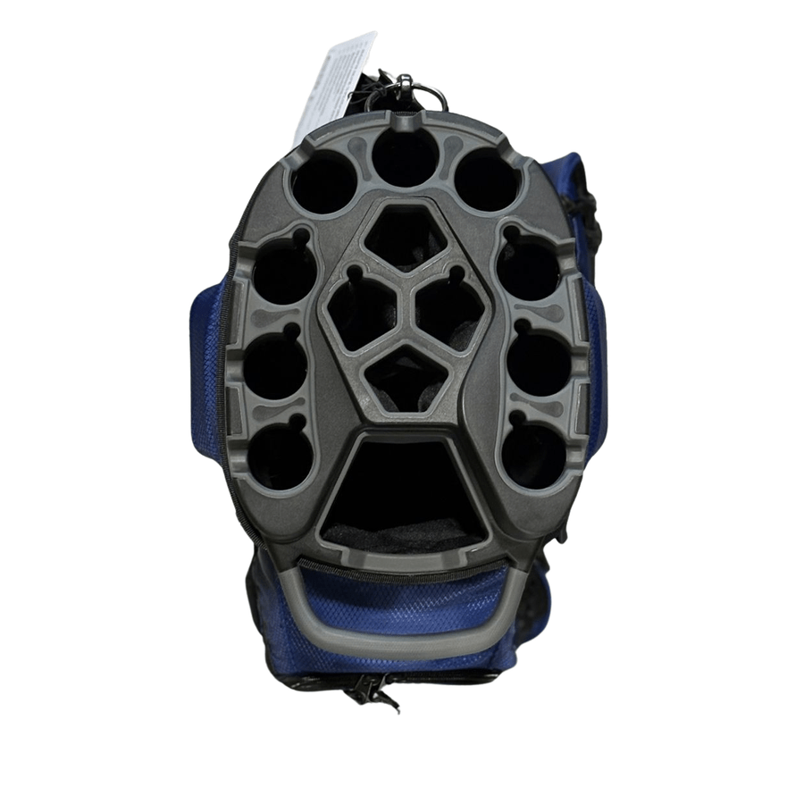 A black and blue NS Deluxe Tour Lock Organizer Cart Bag with a hard, honeycomb-style protective shell viewed from above, featuring multiple round and hexagonal openings and a secure T-Lock Organization System for added safety.