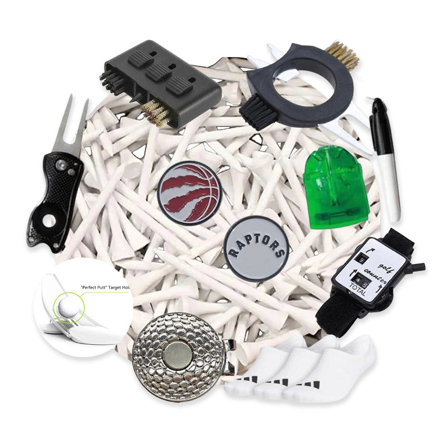 The JGS 2025 Stocking Stuffer! features golf tees, a divot tool, ball marker, brush, socks, score counter, Raptors logo pin, pen, and a green plastic sharpener—all arranged in a circular pattern for the perfect golf gift pack.