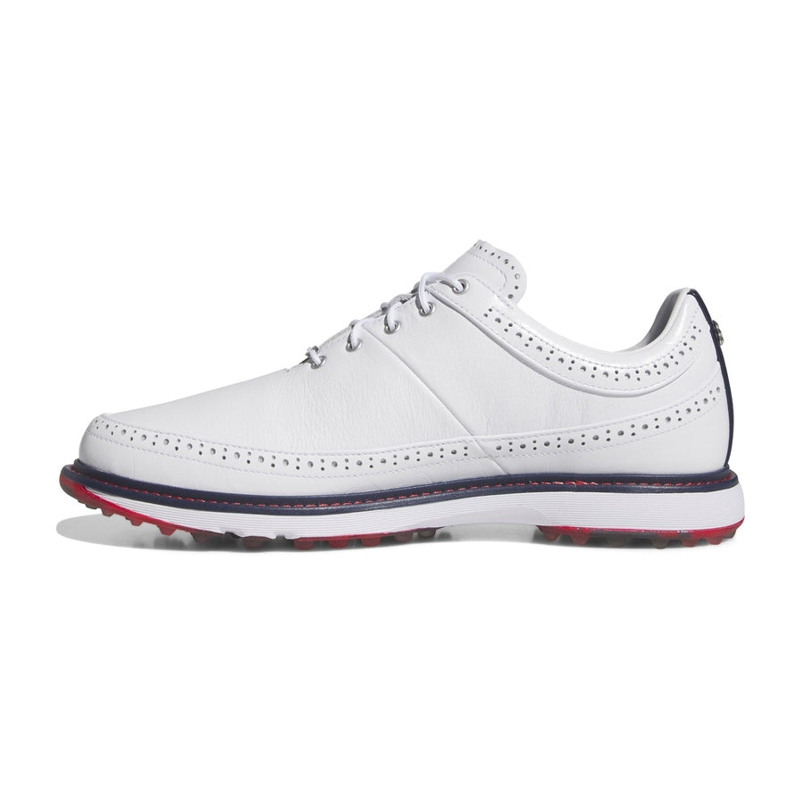 The Adidas MC80 Golf Shoes in White/Red feature white leather with brogue detailing, white laces, and a dark blue and red-accented sole with a BOOST midsole, displayed in side profile on a plain white background.