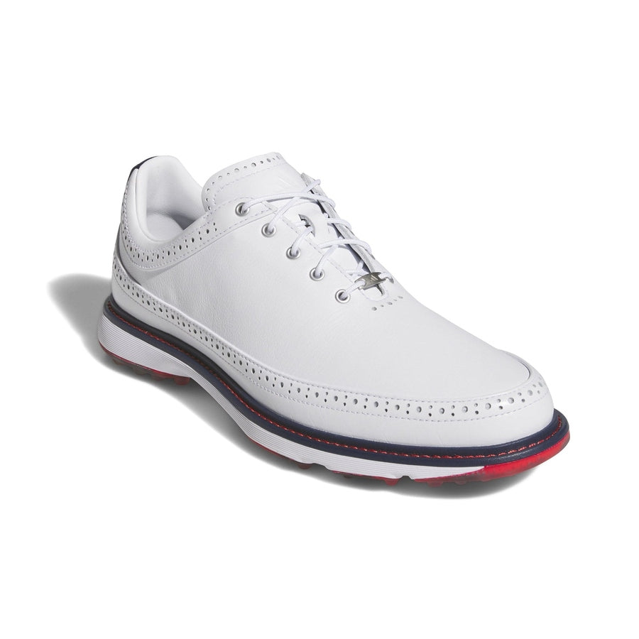 The Adidas MC80 Golf Shoes in White/Red feature a white leather upper with decorative perforations, white laces, a thick white sole with red and navy accents, and a spikeless design. Displayed on a white background.
