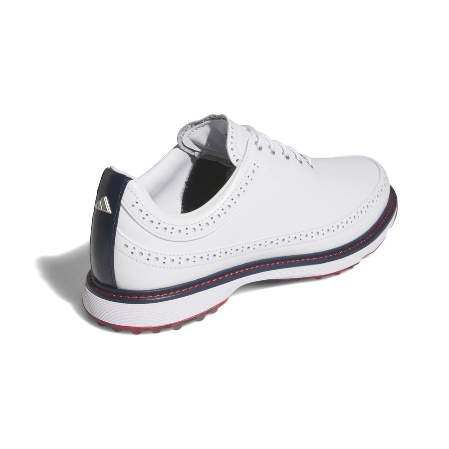 The Adidas MC80 Golf Shoes - White/Red feature white leather with decorative stitching, a navy blue heel accent, red outsole detailing, and a logo on the heel, displayed on a white background.