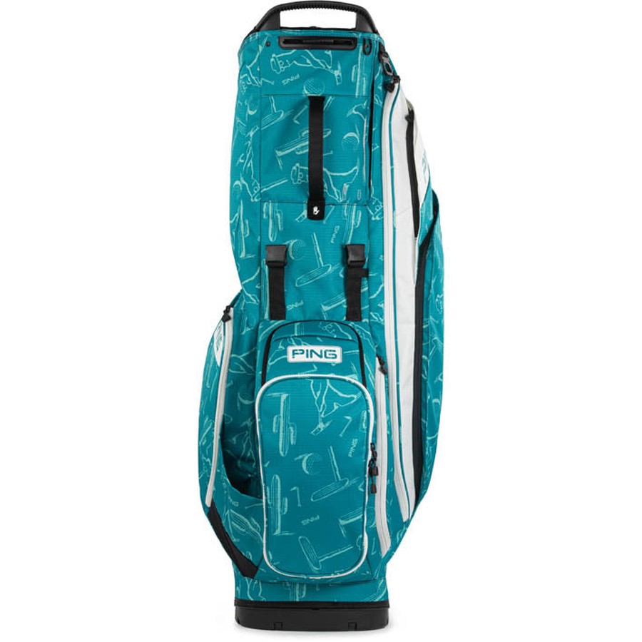 The Ping Hoofer 231 Golf Carry Bag is a lightweight teal bag with white abstract golf club patterns, 16 pockets, black accents, and a white PING logo on the front pocket, shown standing upright against a white background.