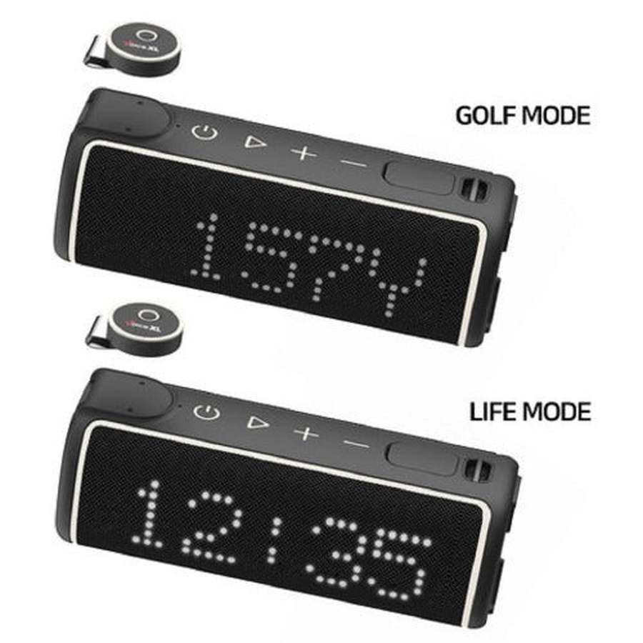 Two black Golf Buddy Voice XL GPS Bluetooth speakers—one displays 157Y in Golf Mode, the other 12:35 in Life Mode. Each includes a small circular device above for pairing with your favorite Golf GPS app.